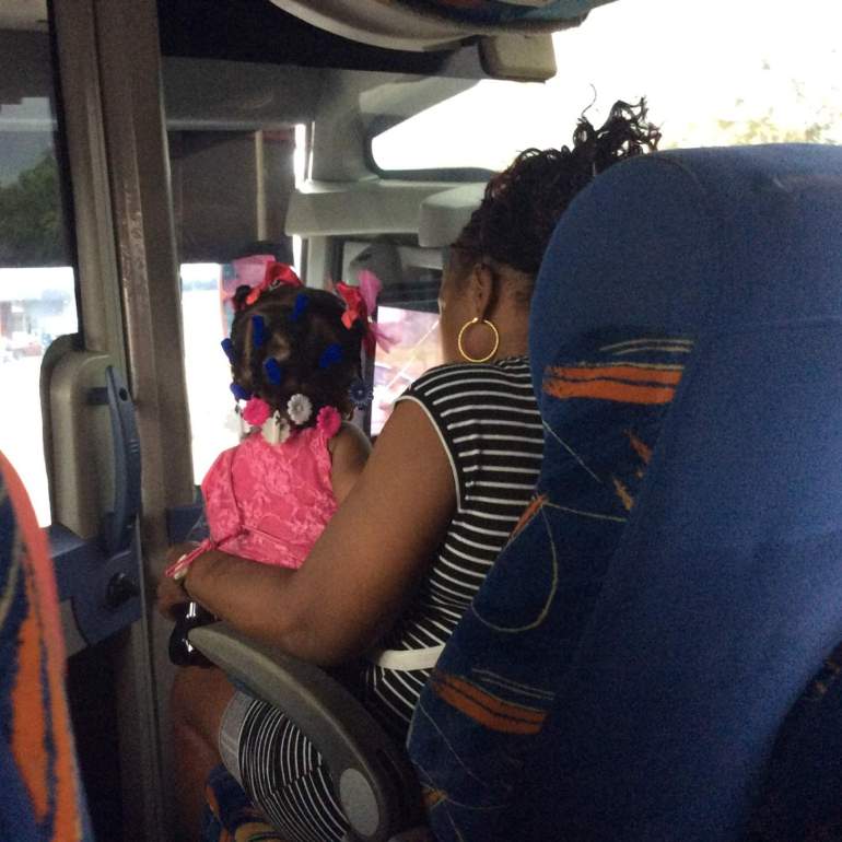 On the bus in Panama City - local child with beautifully decorated hair